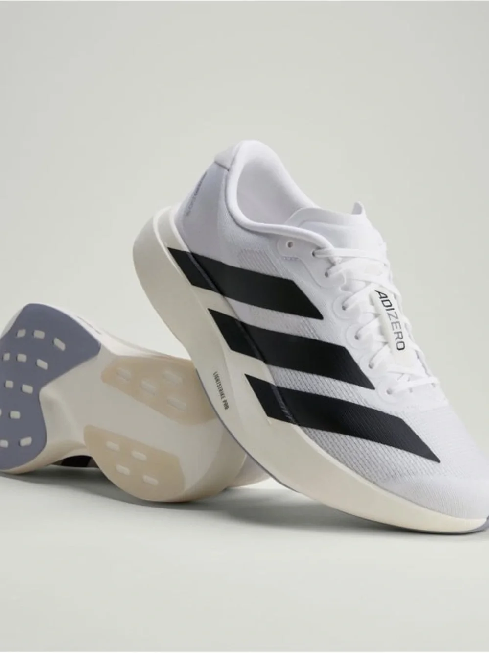 Brand New adidas Adizero Evo SL running shoes in Cloud White and Core Black.